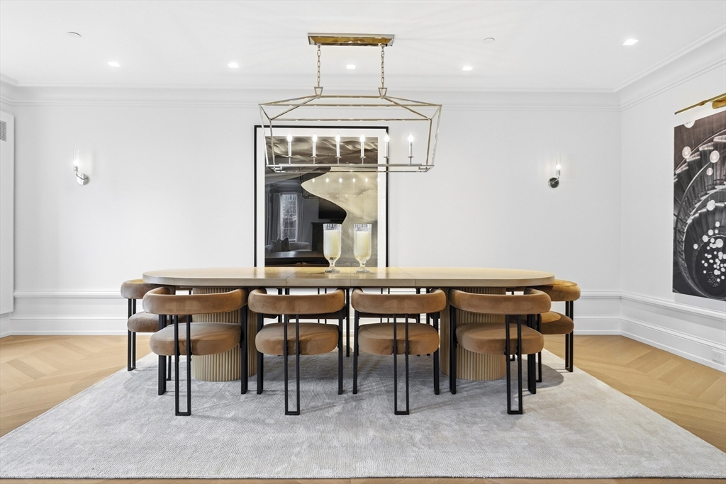 25 Beacon Street, Unit 4 Boston, MA 02108 - Photo 9 of 41 a view of a dining room with furniture wooden floor and a chandelier