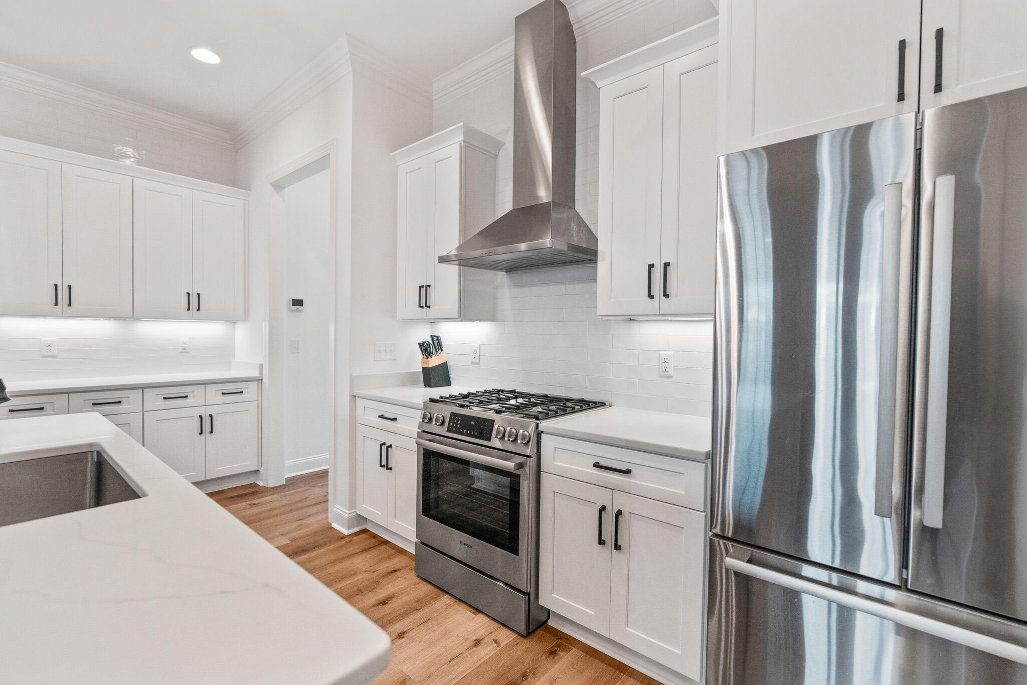 90 Suwannee Dr Inlet Beach Inlet Beach, FL 32461 - Photo 17 of 59 a kitchen with stainless steel appliances a stove a refrigerator and cabinets