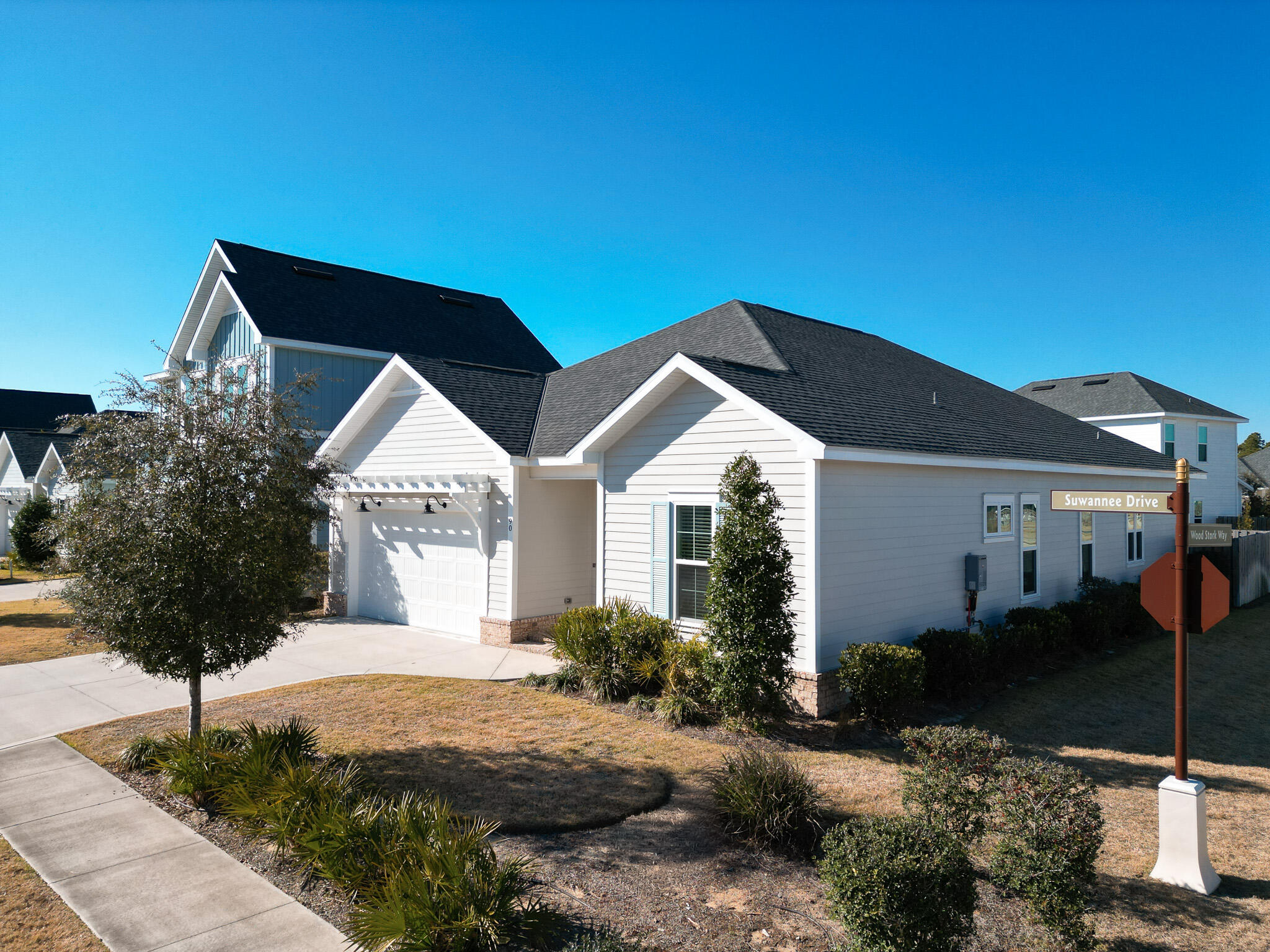 90 Suwannee Dr Inlet Beach Inlet Beach, FL 32461 - Photo 2 of 59 a front view of house with yard and trees