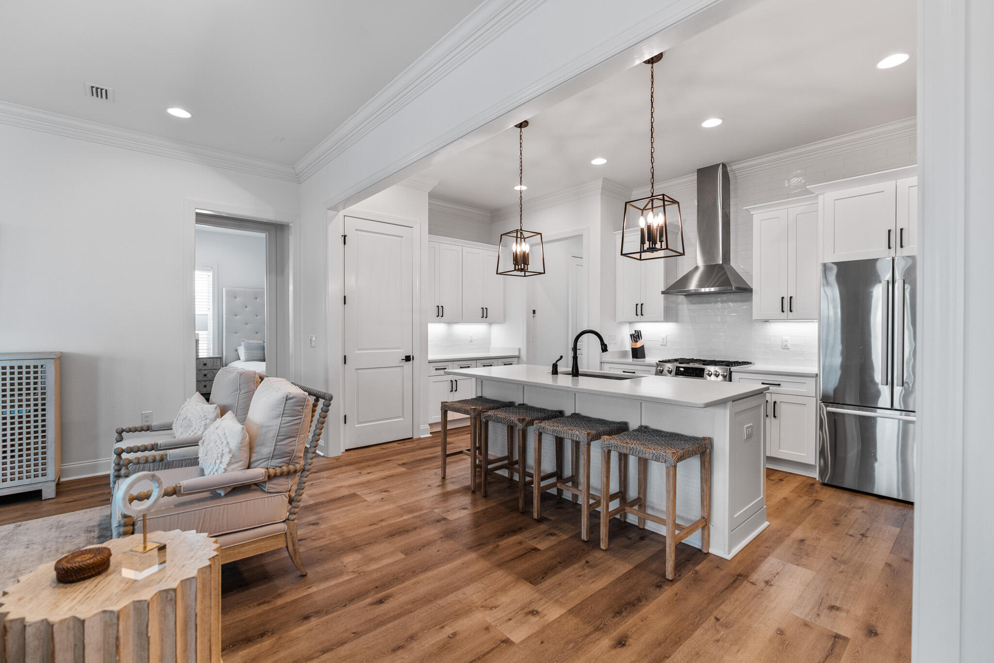 90 Suwannee Dr Inlet Beach Inlet Beach, FL 32461 - Photo 59 of 59 a kitchen with stainless steel appliances granite countertop a stove refrigerator a dining table and chairs with wooden floor