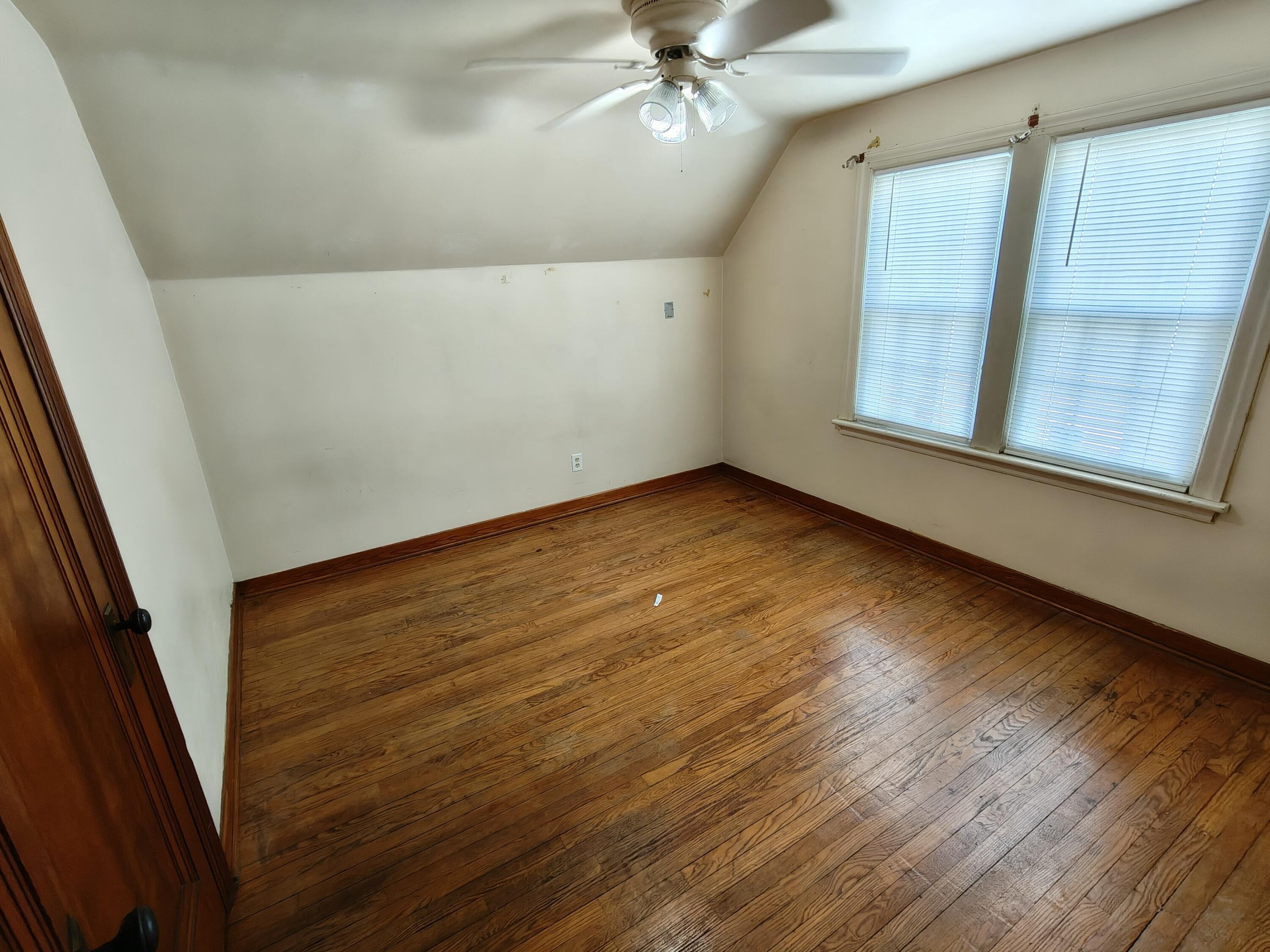 245 North Indiana Street Griffith, IN 46319 - Photo 15 of 30 wooden floor in an empty room with a window
