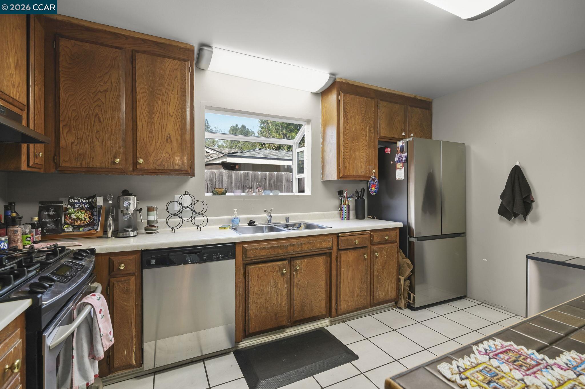 3922 Bayview Circle Concord, CA 94520 - Photo 13 of 30 a kitchen with a sink appliances and cabinets