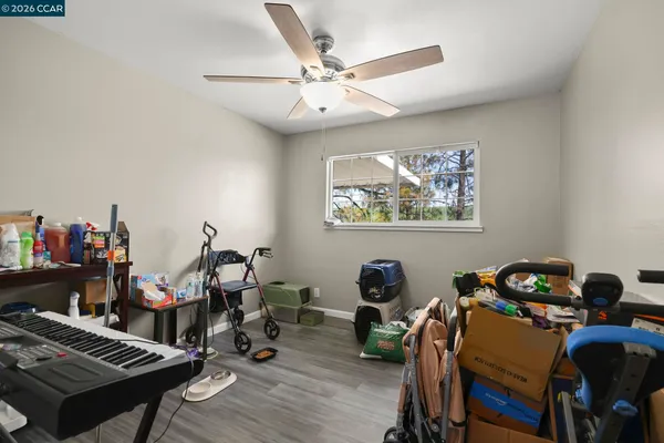 a view of a workspace with furniture and wooden floor