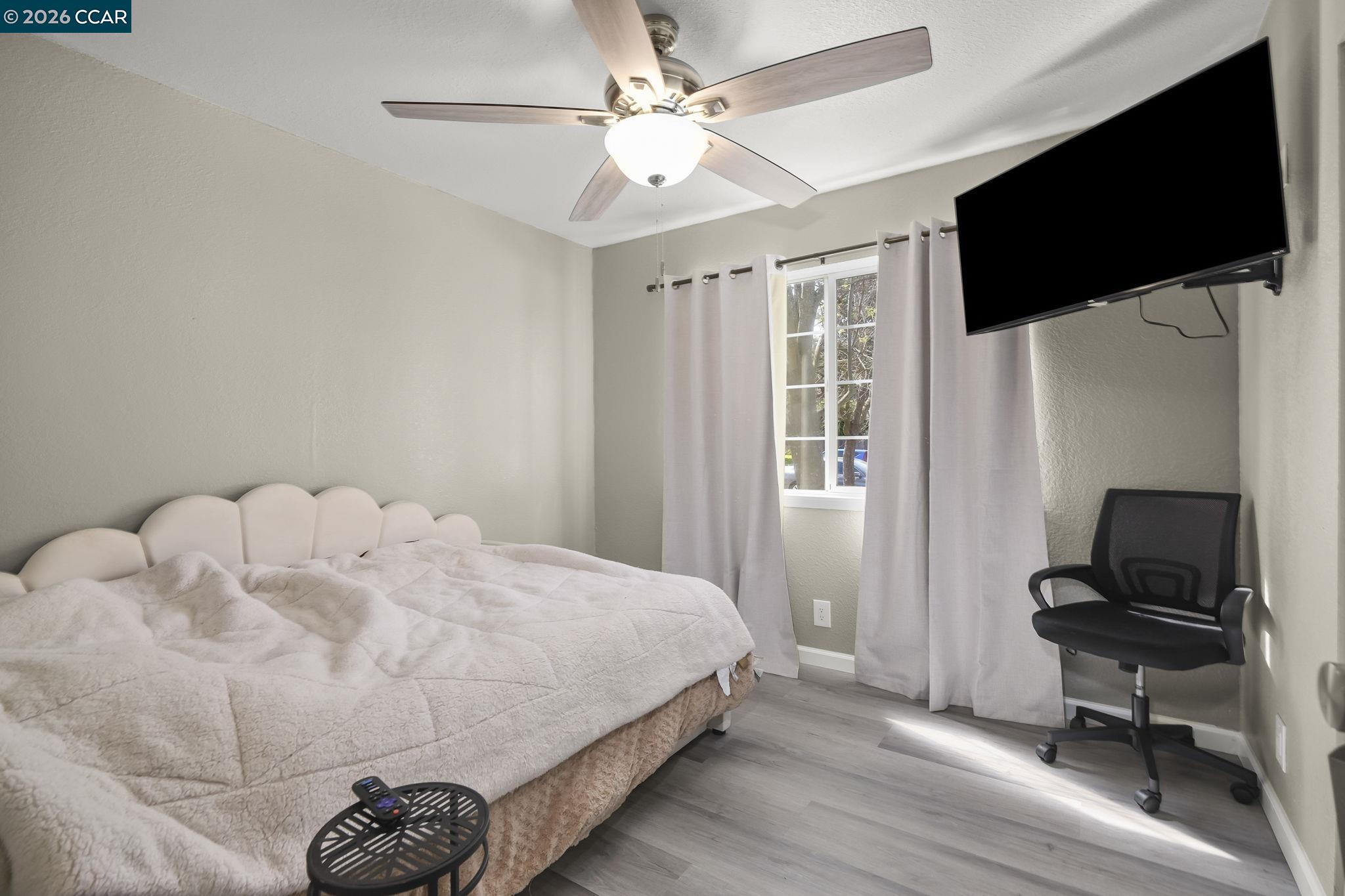 3922 Bayview Circle Concord, CA 94520 - Photo 19 of 30 a bedroom with a bed and a flat screen tv