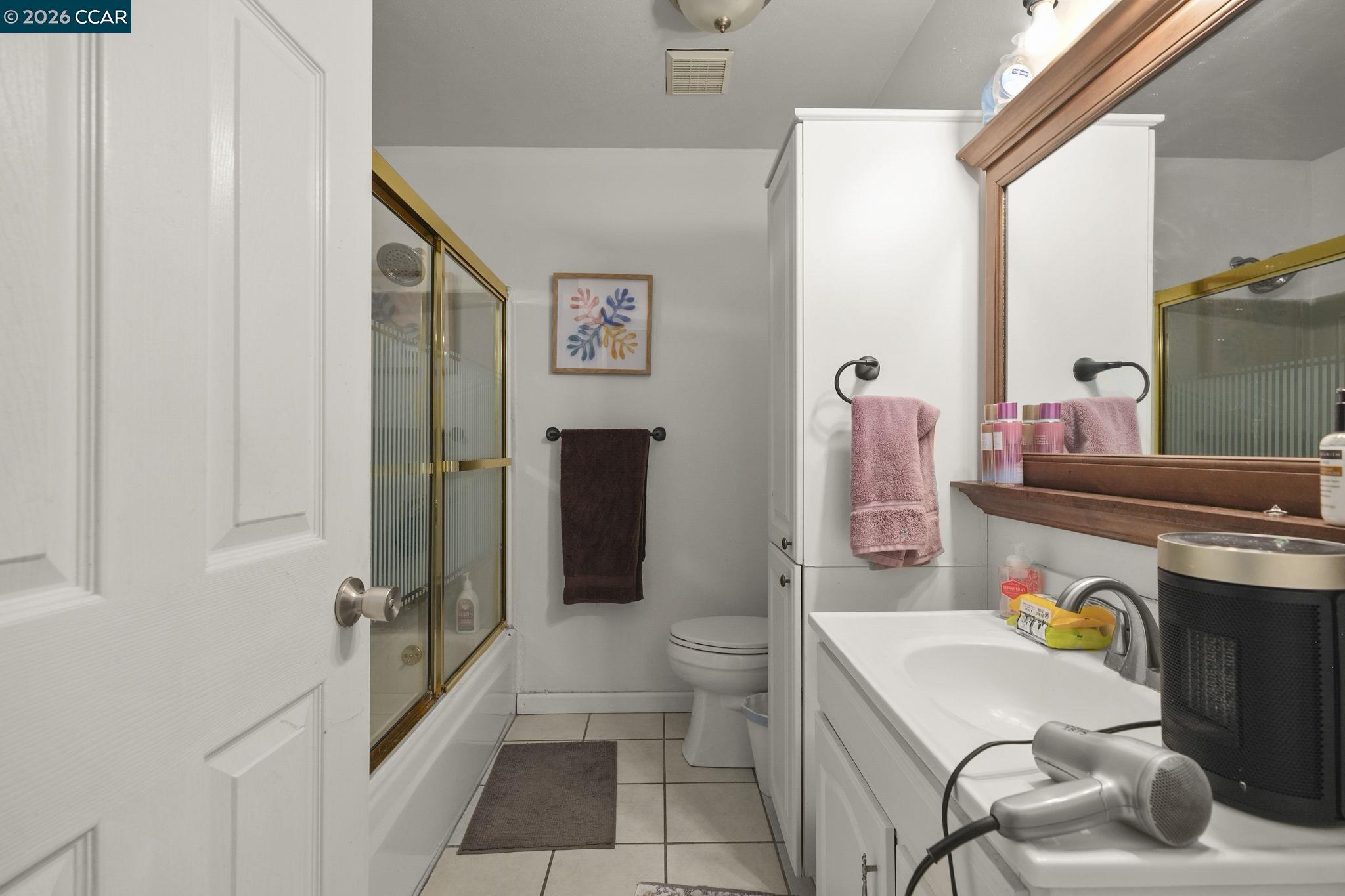 3922 Bayview Circle Concord, CA 94520 - Photo 20 of 30 a bathroom with a sink mirror vanity and toilet
