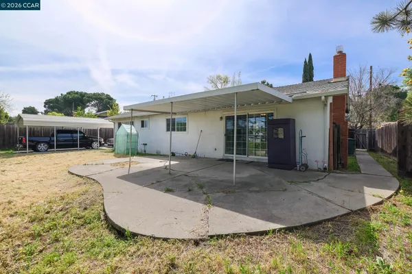 a view of a patio with table and chairs with wooden floor