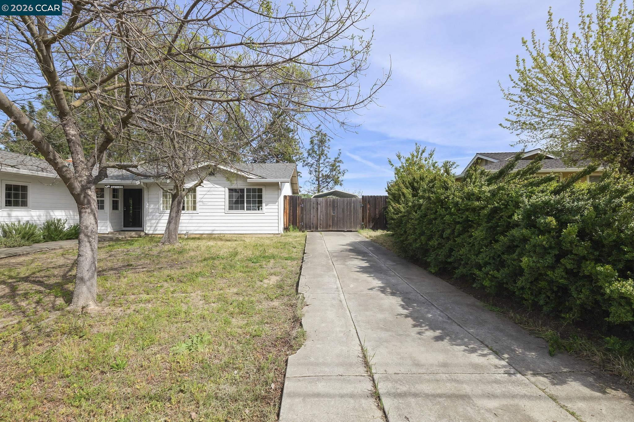 3922 Bayview Circle Concord, CA 94520 - Photo 3 of 30 a view of a yard with plants and large trees