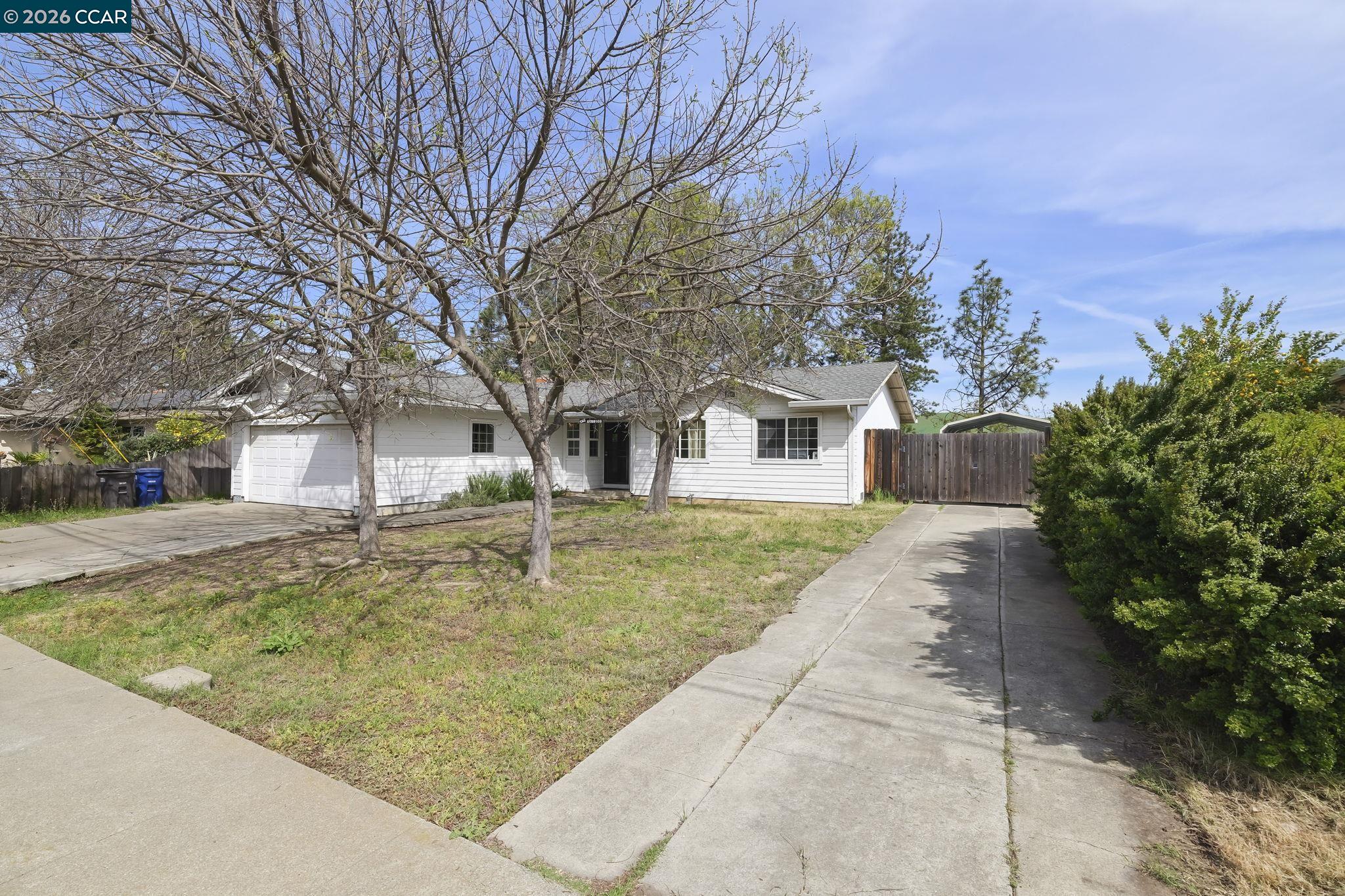 3922 Bayview Circle Concord, CA 94520 - Photo 4 of 30 a view of a white house with a yard