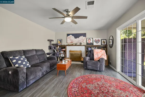a living room with furniture and a fireplace