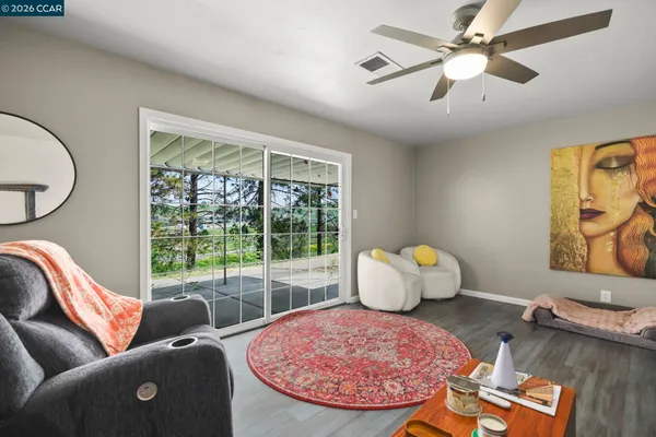 a living room with furniture and a window