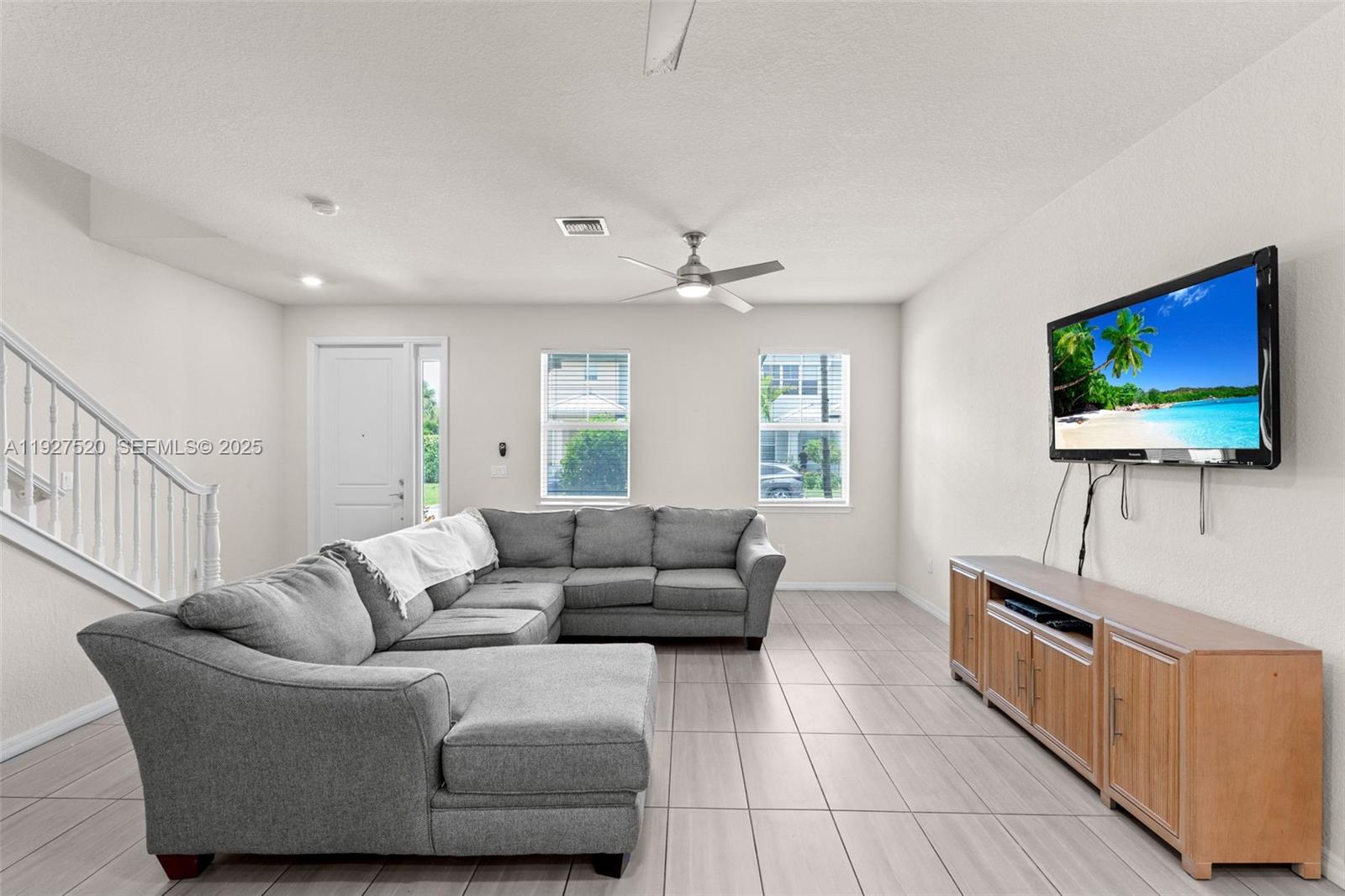 1190 Eucalyptus Drive, Unit 5 Hollywood, FL 33021 - Photo 11 of 42 a living room with furniture and a flat screen tv