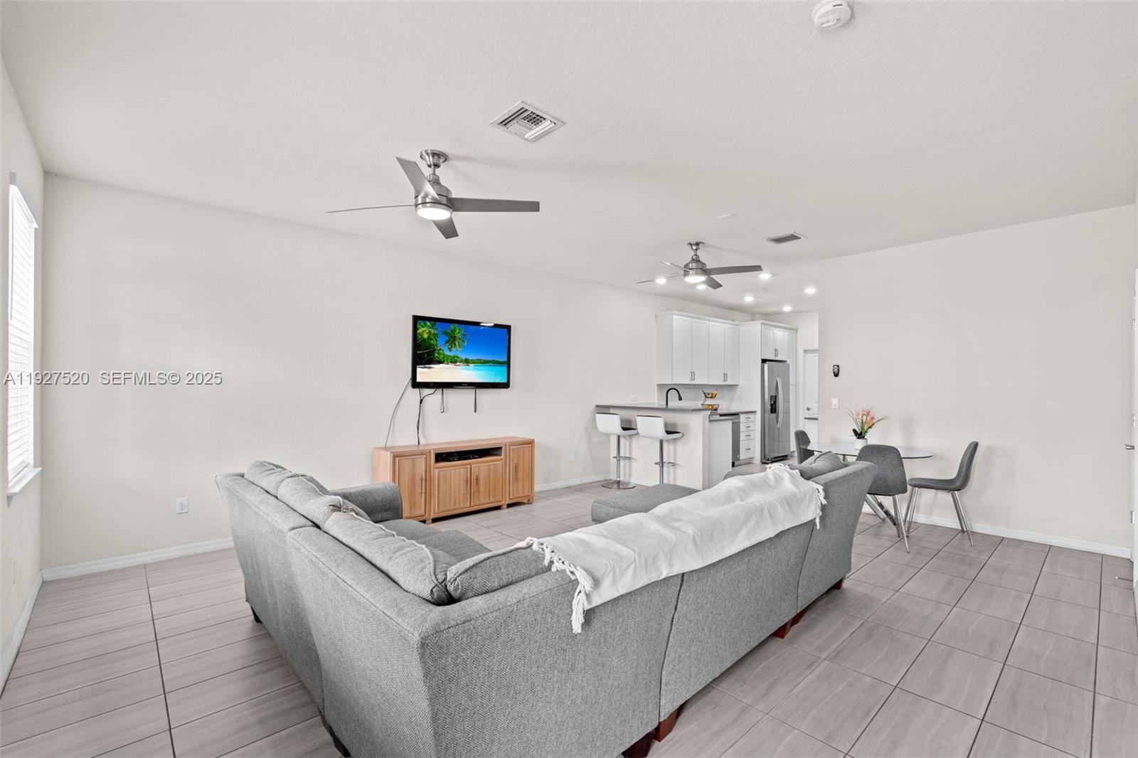 1190 Eucalyptus Drive, Unit 5 Hollywood, FL 33021 - Photo 14 of 42 a living room with furniture and a ceiling fan