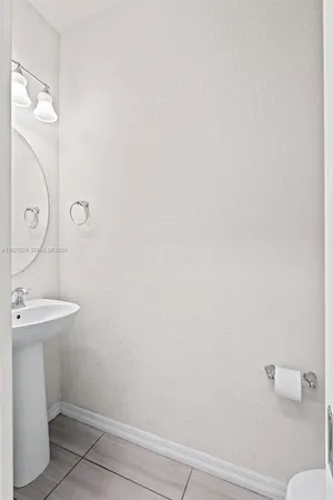 a bathroom with a sink and toilet