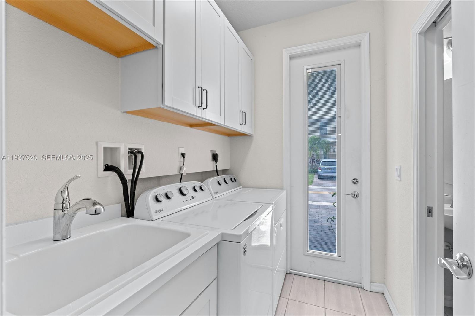 1190 Eucalyptus Drive, Unit 5 Hollywood, FL 33021 - Photo 18 of 42 a bathroom with a sink and a mirror