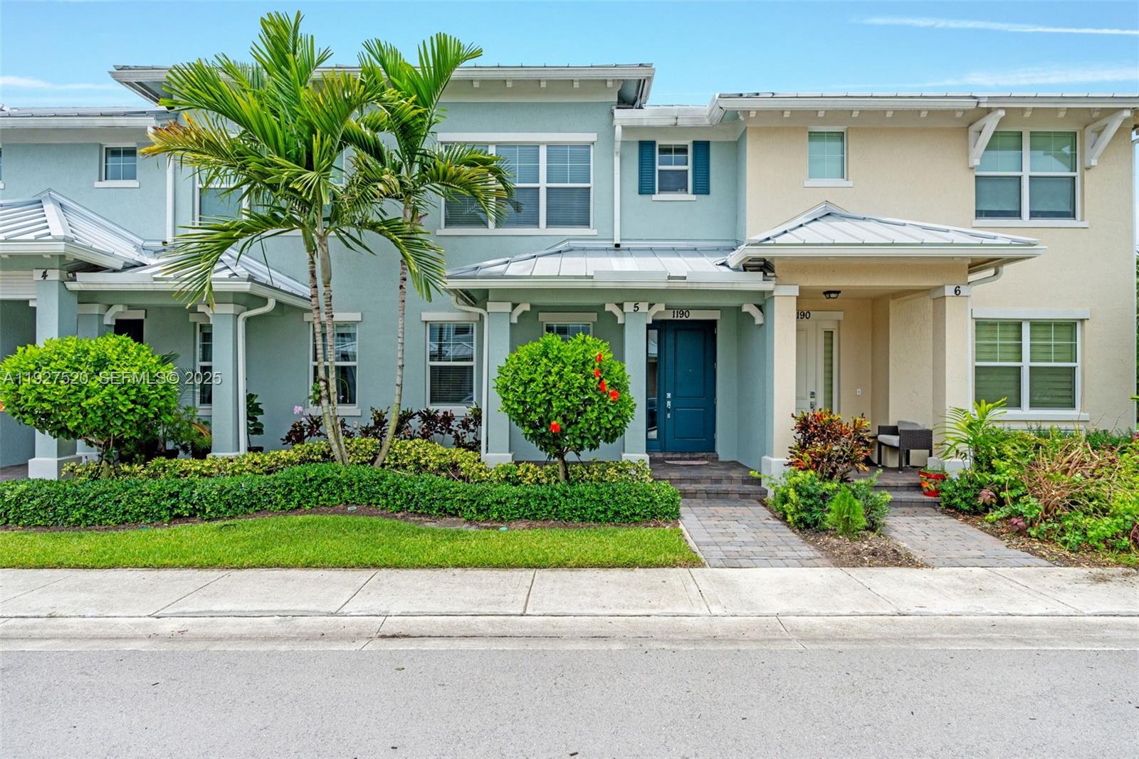 1190 Eucalyptus Drive, Unit 5 Hollywood, FL 33021 - Photo 2 of 42 a front view of a house with a garden and plants