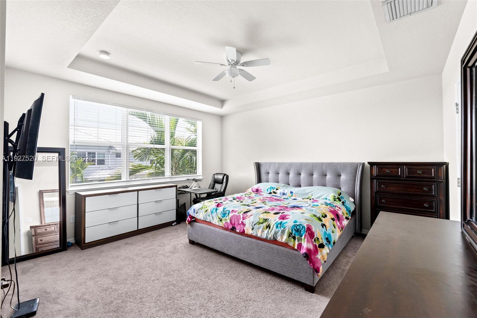 1190 Eucalyptus Drive, Unit 5 Hollywood, FL 33021 - Photo 22 of 42 a bedroom with a bed and a larger window