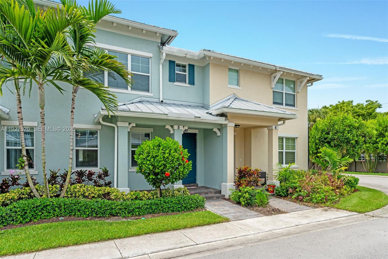 1190 Eucalyptus Drive, Unit 5 Hollywood, FL 33021 - Photo 3 of 42 a front view of a house with garden and plants