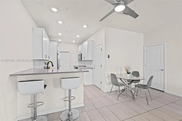 a kitchen with a sink cabinets and window