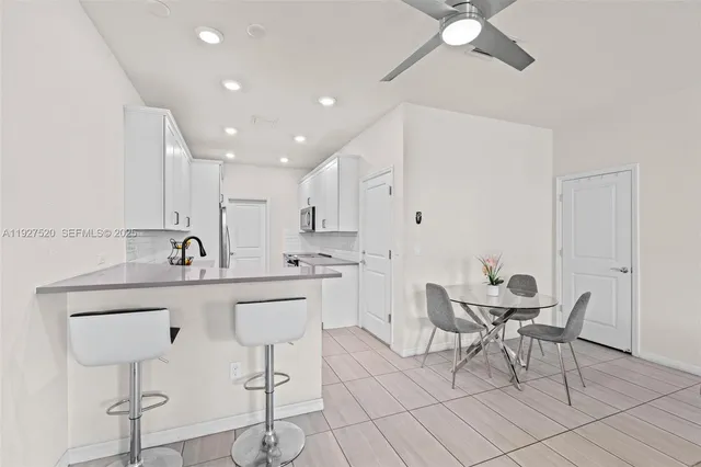 a kitchen with a sink cabinets and window
