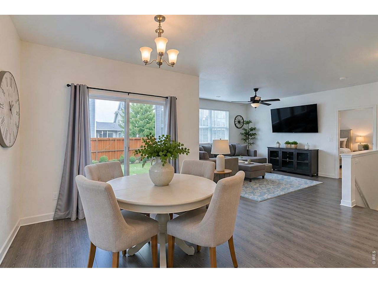1269 Wild Basin Road Severance, CO 80550 - Photo 16 of 45 Dining with slider to covered patio-photo virtually enhanced