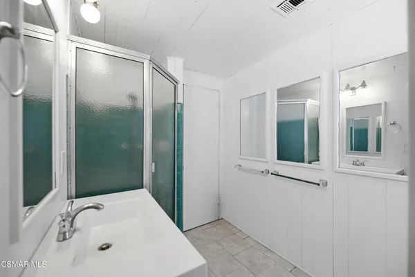 a bathroom with a bathtub and a sink
