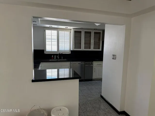 a kitchen with a sink and a window