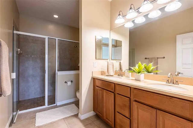 a bathroom with a double vanity sink and mirror