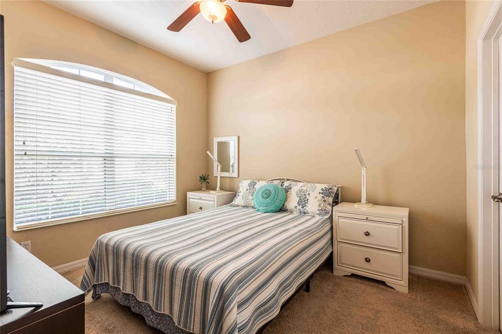2735 Rutledge Court Winter Haven, FL 33884 - Photo 12 of 42 a bedroom with a bed and a window