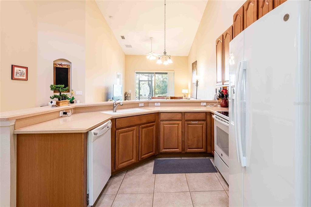 2735 Rutledge Court Winter Haven, FL 33884 - Photo 21 of 42 a kitchen with a sink and cabinets