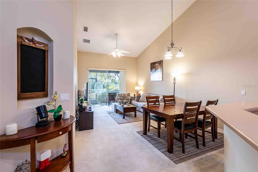 2735 Rutledge Court Winter Haven, FL 33884 - Photo 24 of 42 a living room with furniture potted plant and a window
