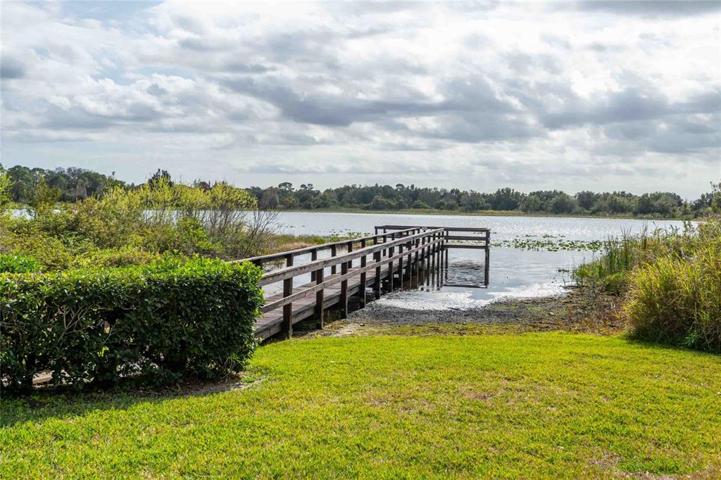 2735 Rutledge Court Winter Haven, FL 33884 - Photo 32 of 42 a view of a lake with a garden