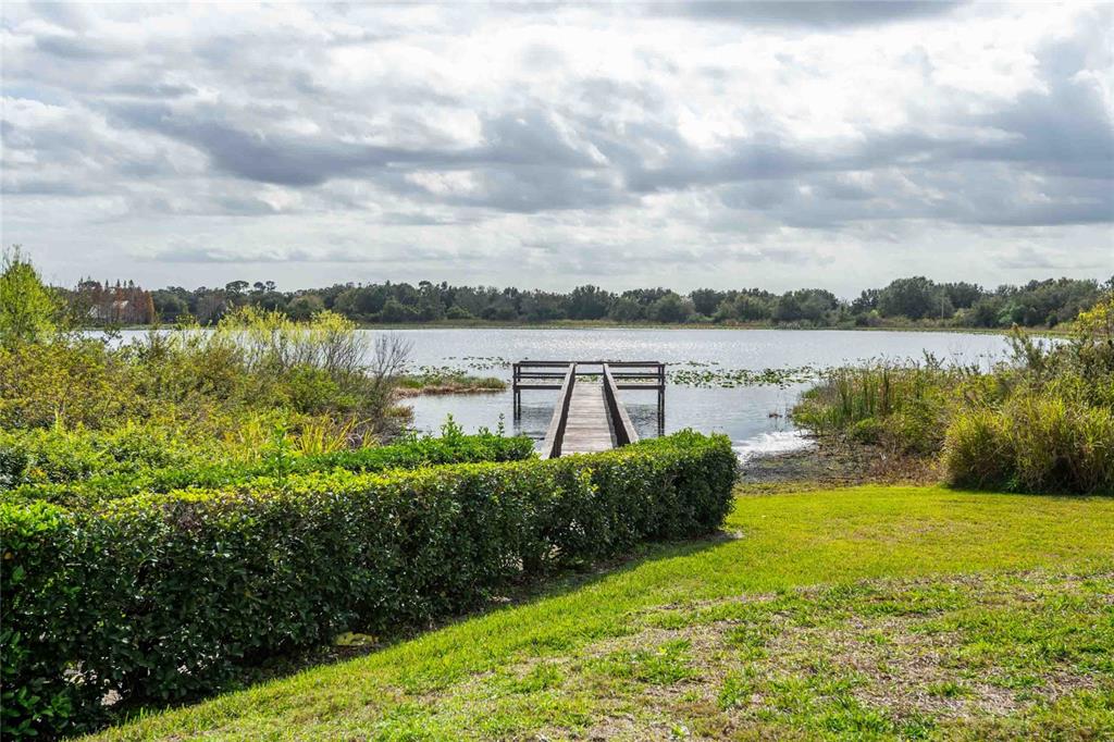 2735 Rutledge Court Winter Haven, FL 33884 - Photo 34 of 42 a view of a lake with a big yard
