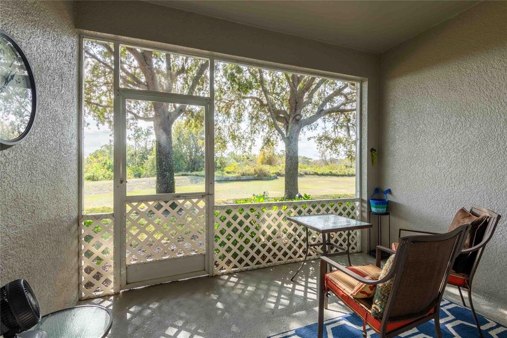 2735 Rutledge Court Winter Haven, FL 33884 - Photo 4 of 42 a view of a room with furniture and large windows