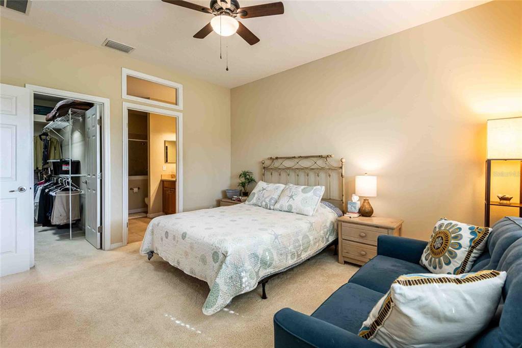 2735 Rutledge Court Winter Haven, FL 33884 - Photo 9 of 42 a bedroom with a bed couches and a chair