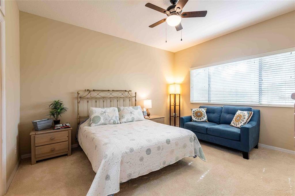 2735 Rutledge Court Winter Haven, FL 33884 - Photo 10 of 42 a bedroom with a bed couch and window