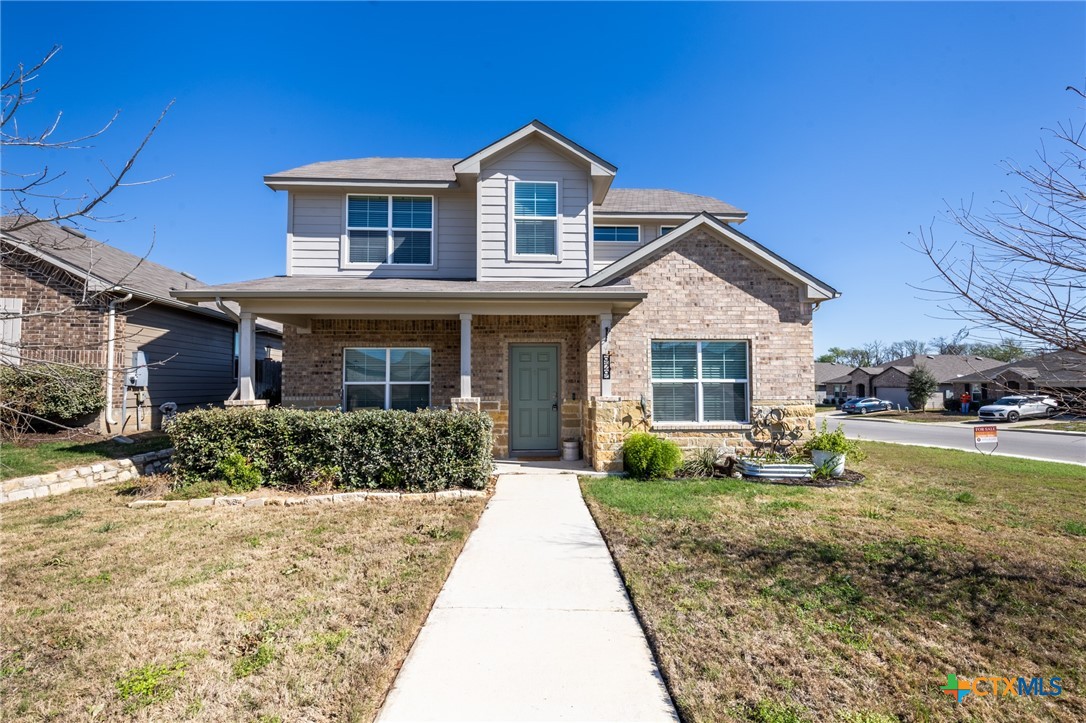 929 Indigo Way Seguin, TX 78155 - Photo 1 of 37 a front view of a house with a yard