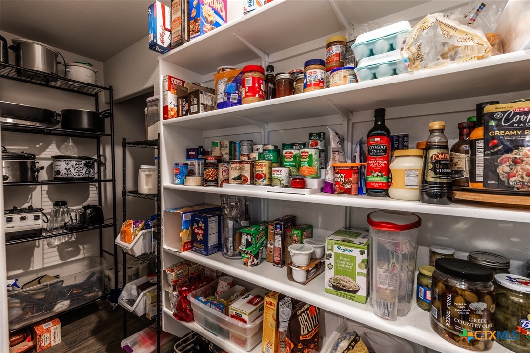 929 Indigo Way Seguin, TX 78155 - Photo 13 of 37 a store room with lots of different kinds of food