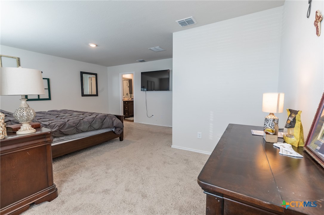 929 Indigo Way Seguin, TX 78155 - Photo 19 of 30 a living room with furniture and a flat screen tv