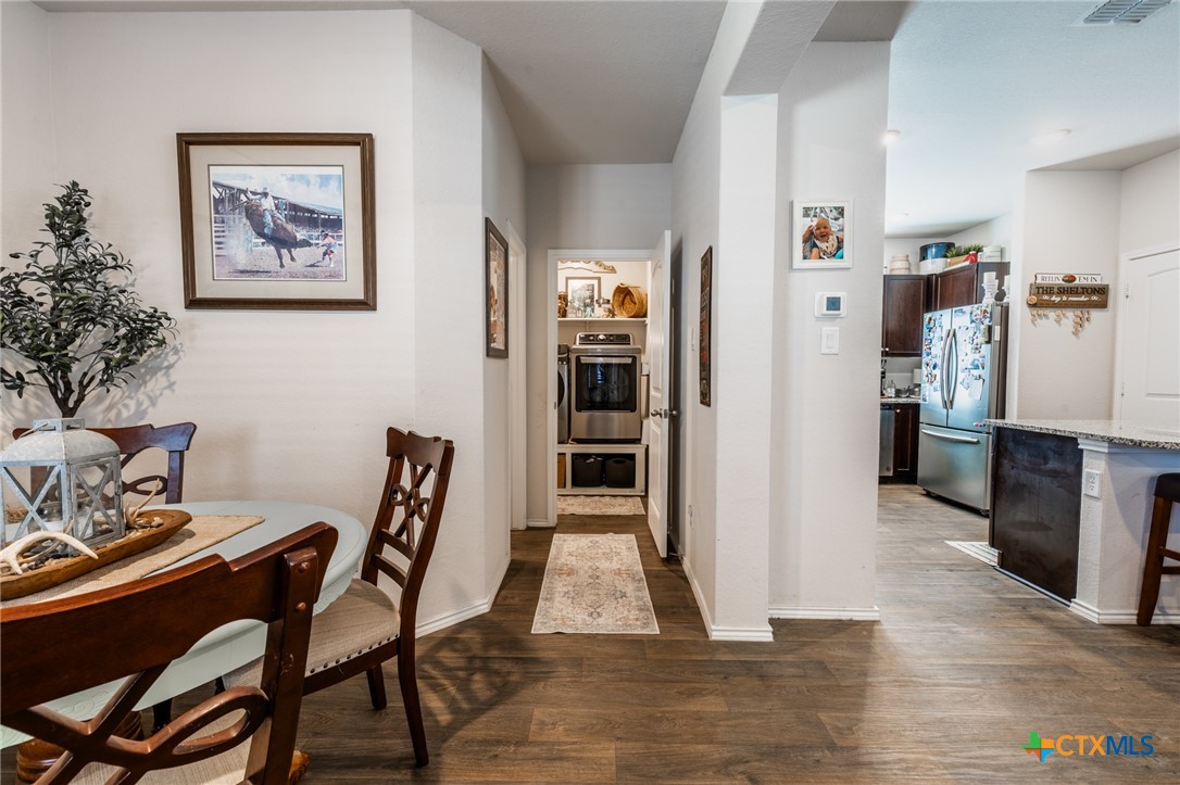 929 Indigo Way Seguin, TX 78155 - Photo 19 of 37 a view of a dining room with furniture and wooden floor