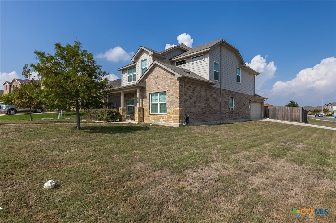 929 Indigo Way Seguin, TX 78155 - Photo 2 of 30 a front view of a house with a yard