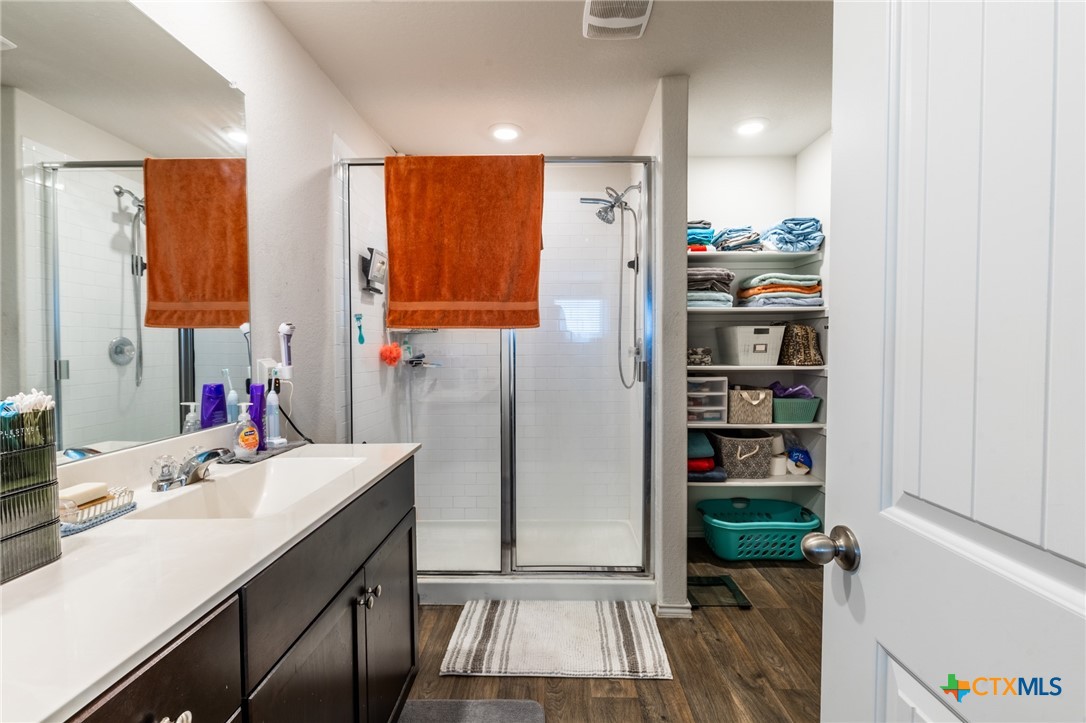929 Indigo Way Seguin, TX 78155 - Photo 22 of 37 a bathroom with a sink and a mirror
