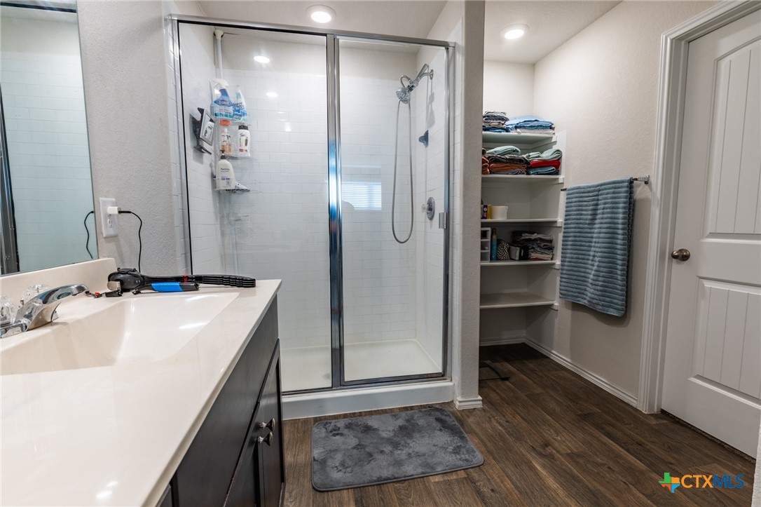 929 Indigo Way Seguin, TX 78155 - Photo 22 of 30 a bathroom with a sink and a mirror