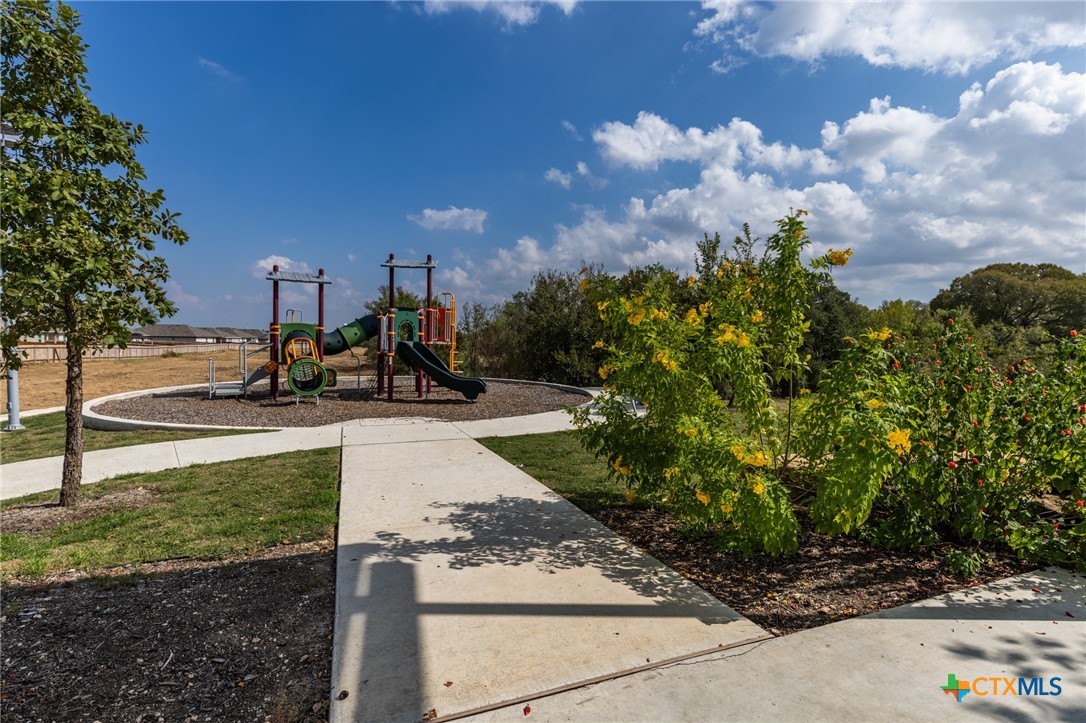 929 Indigo Way Seguin, TX 78155 - Photo 31 of 37 a view of a park with swings and slides