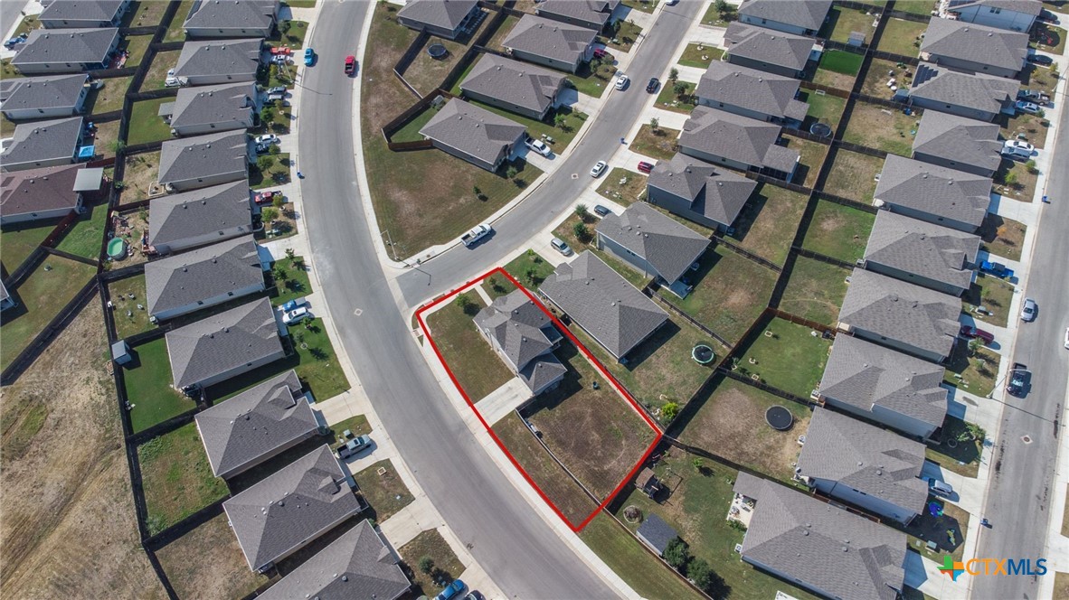 929 Indigo Way Seguin, TX 78155 - Photo 37 of 37 an aerial view of a residential apartment building with a yard