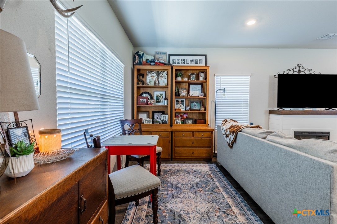 929 Indigo Way Seguin, TX 78155 - Photo 6 of 37 a room with furniture and a flat screen tv