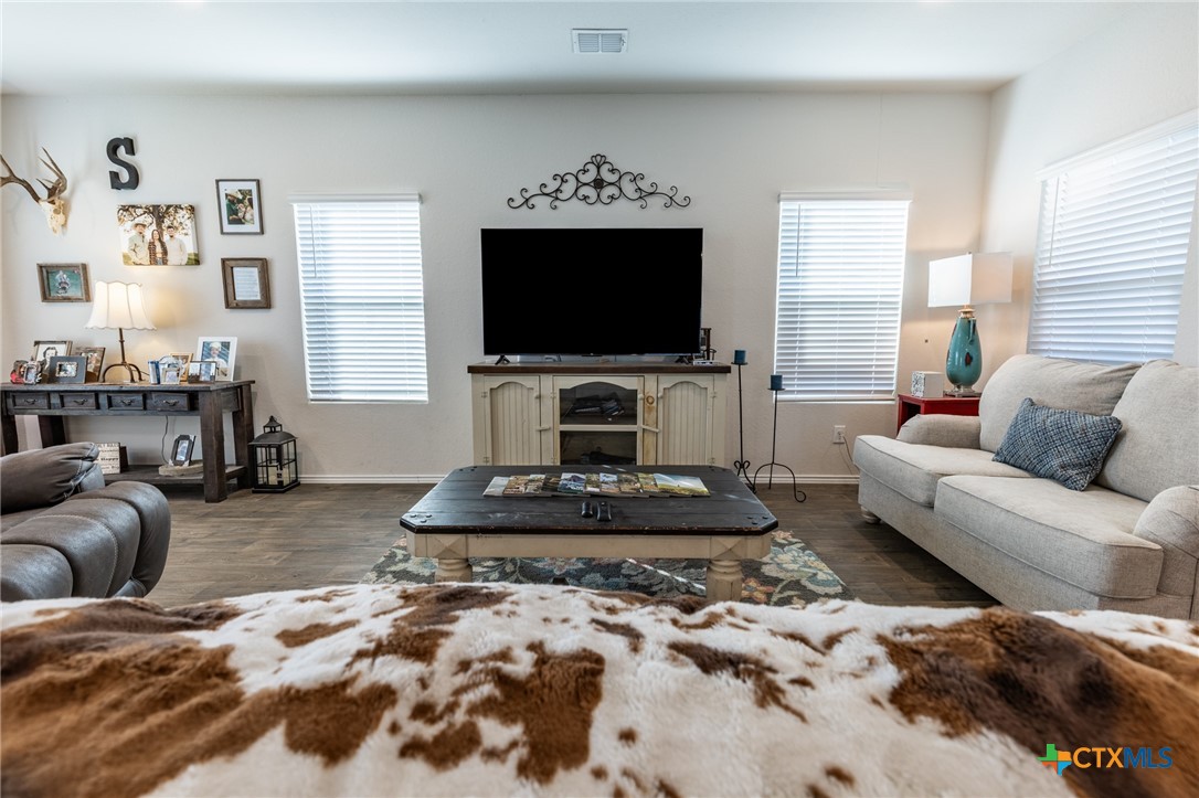 929 Indigo Way Seguin, TX 78155 - Photo 6 of 30 a living room with furniture and a flat screen tv