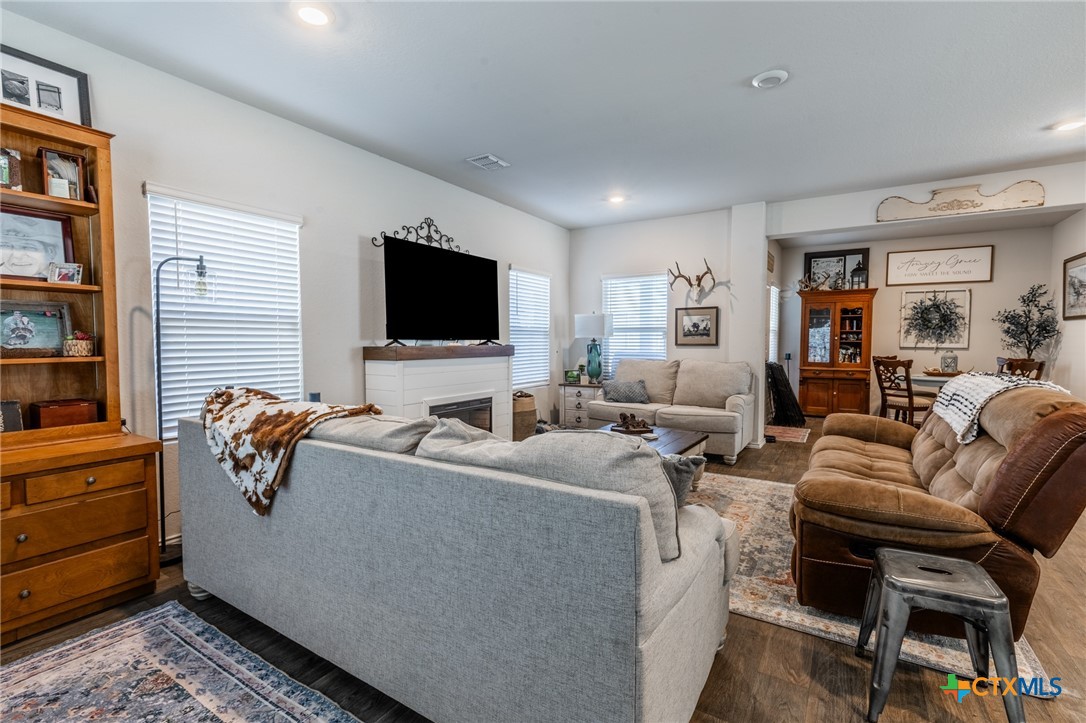 929 Indigo Way Seguin, TX 78155 - Photo 7 of 37 a living room with furniture and a flat screen tv