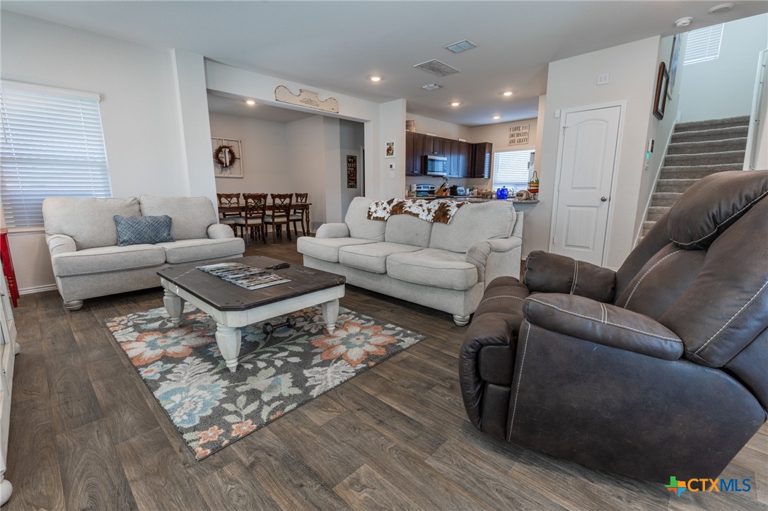 929 Indigo Way Seguin, TX 78155 - Photo 8 of 30 a living room with furniture or kitchen view and a wooden floor