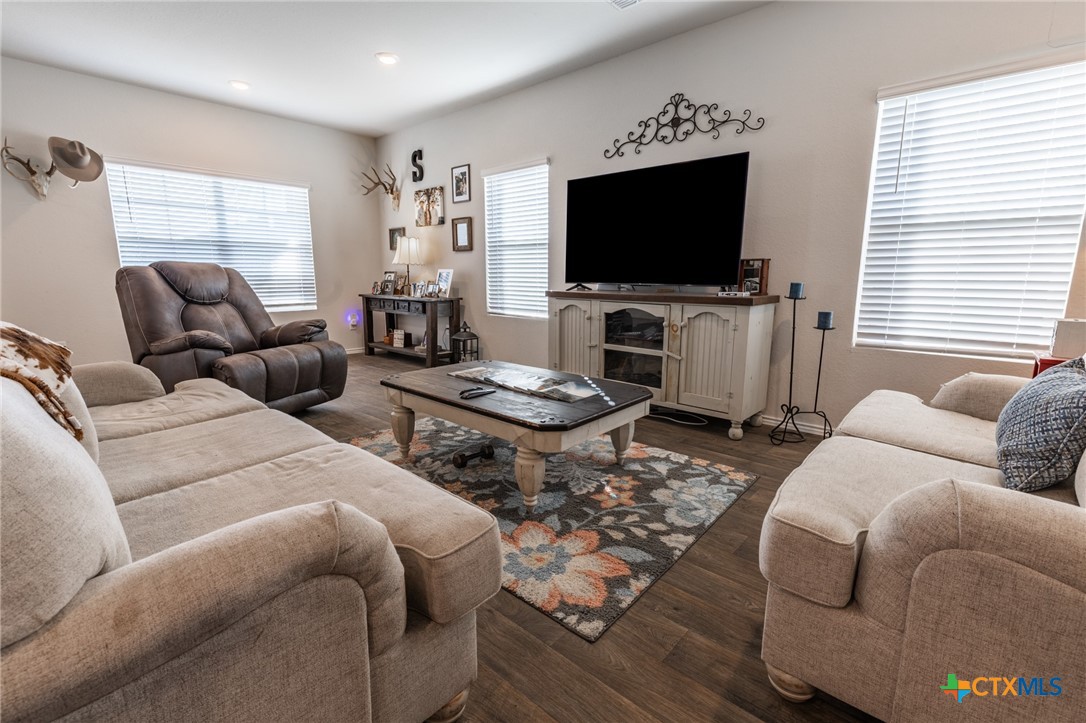 929 Indigo Way Seguin, TX 78155 - Photo 9 of 30 a living room with furniture and a flat screen tv