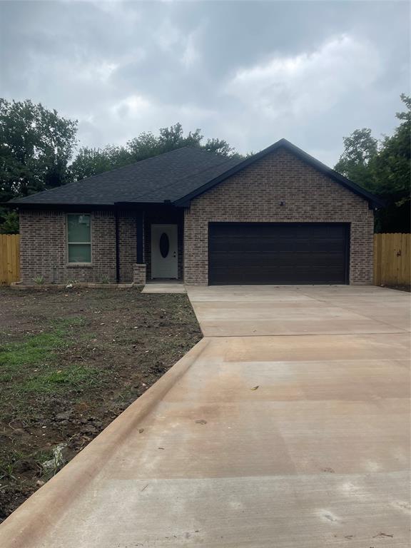 a front view of a house with yard